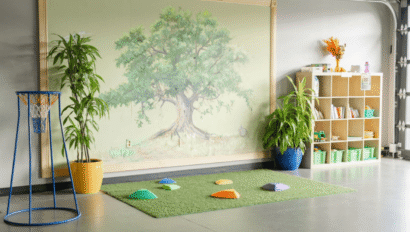Children's indoor play area with a nature-themed mural and colorful stepping stones.