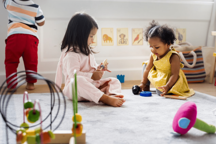 two pre-k students playing.